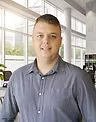 Smiling professional in a collared dress shirt