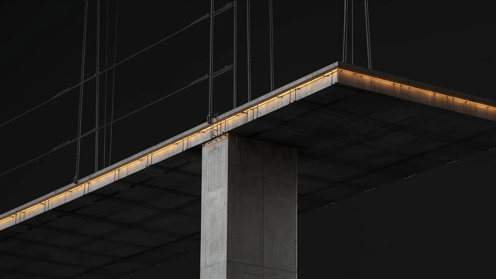 Exposed reinforced concrete column meeting a suspended slab with visible rebar and formwork lines.